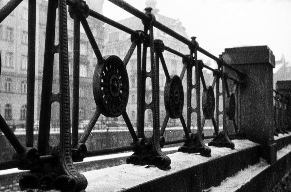 A black and white photography of a fence