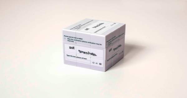 Katherine Behar Not from Asia, 2017 Customized Rubik’s cube with screenshot of found
                                          reCAPTCHA. 2 ¼
